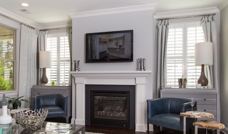 Kingsport fireplace with white shutters.